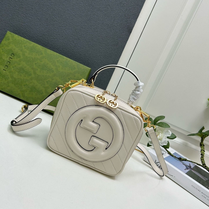 G*u*i top handle bags